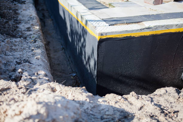 Professional Waterproofing technician working in Brecksville, OH